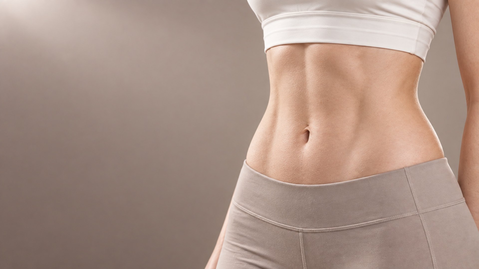 Front view of a woman's abdomen showing her waistline